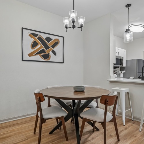 a large kitchen with a dining table