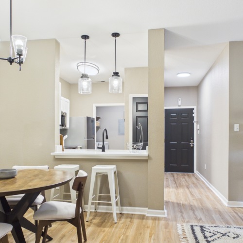 a large kitchen with a dining table